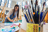 A student in art class. Links to Tangible Personal Property